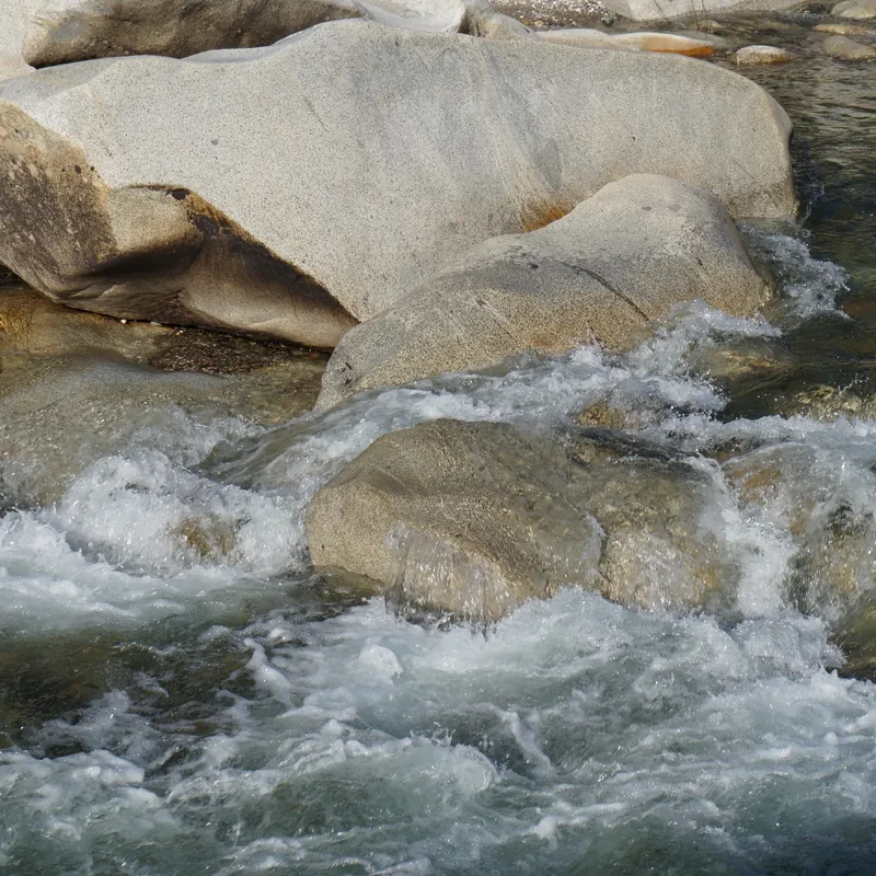 Rushing river rapids symbolizing overcoming turbulent dissertation obstacles